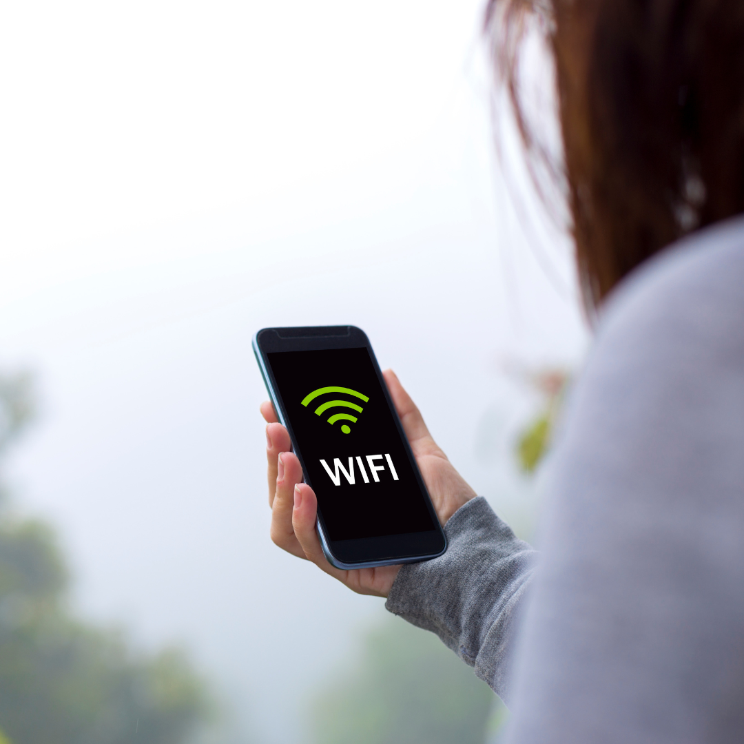Photo of woman connecting to WiFi